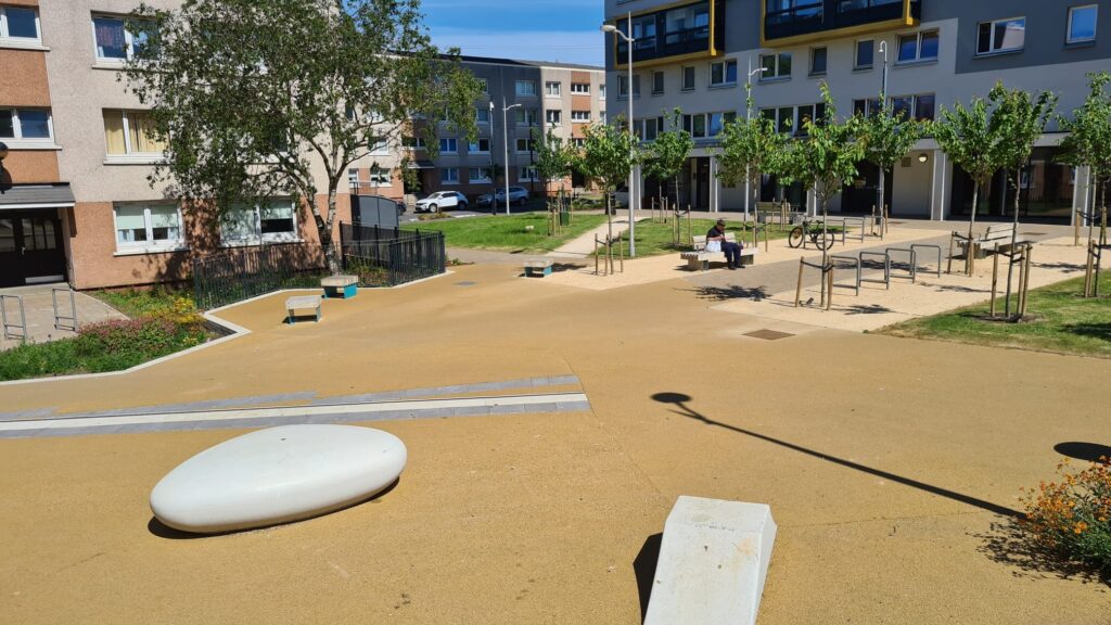 A sunny courtyard within a housing estate