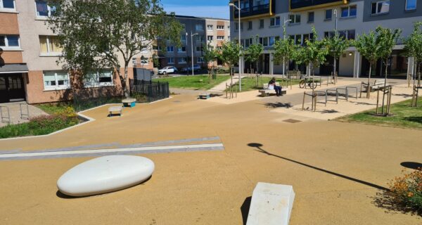 A sunny courtyard within a housing estate